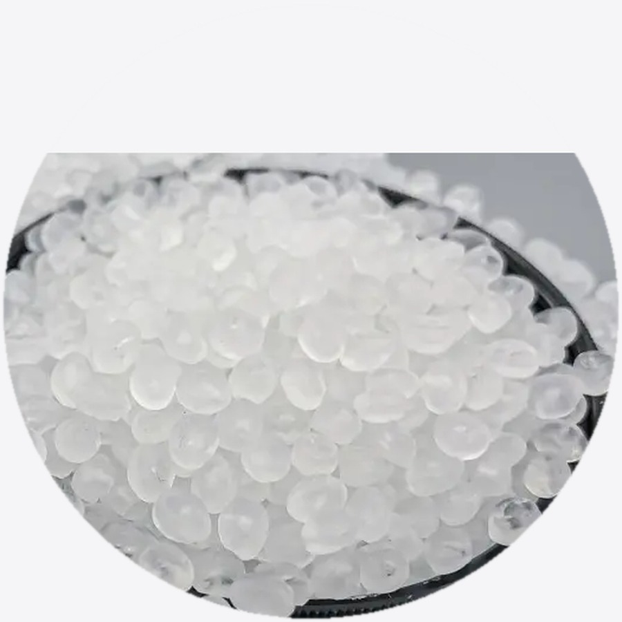 Clear virgin polymer resin pellets in a dish — Mega Win polymer business
